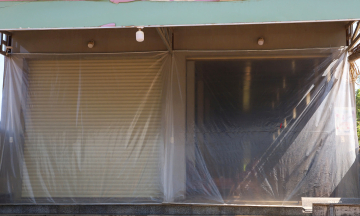 Residents cover homes with nylon to avoid 'dust storms' from Phu Cat airport