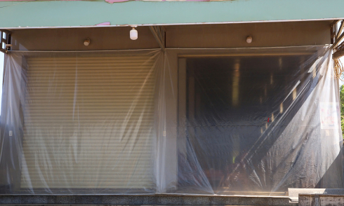 Residents cover homes with nylon to avoid 'dust storms' from Phu Cat airport