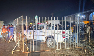 Cambodia investigates group using iron fences to surround police car