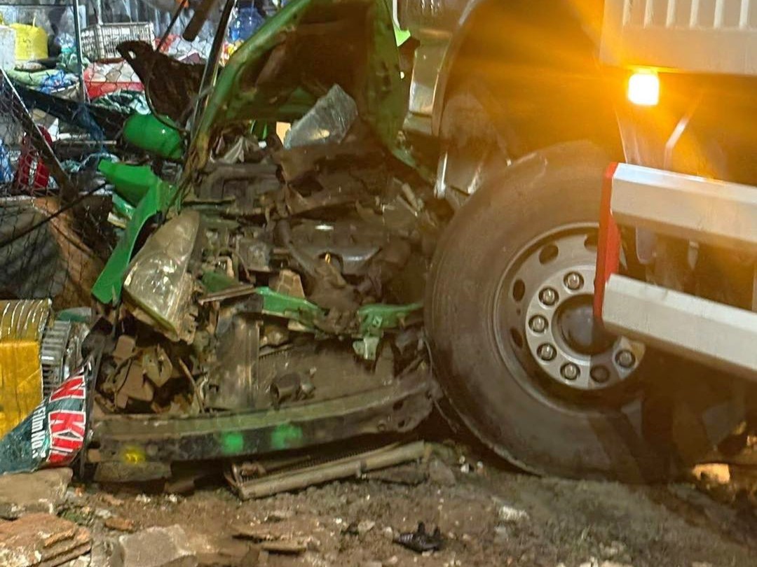 Taxi carrying ba people crushed by truck, driver dies