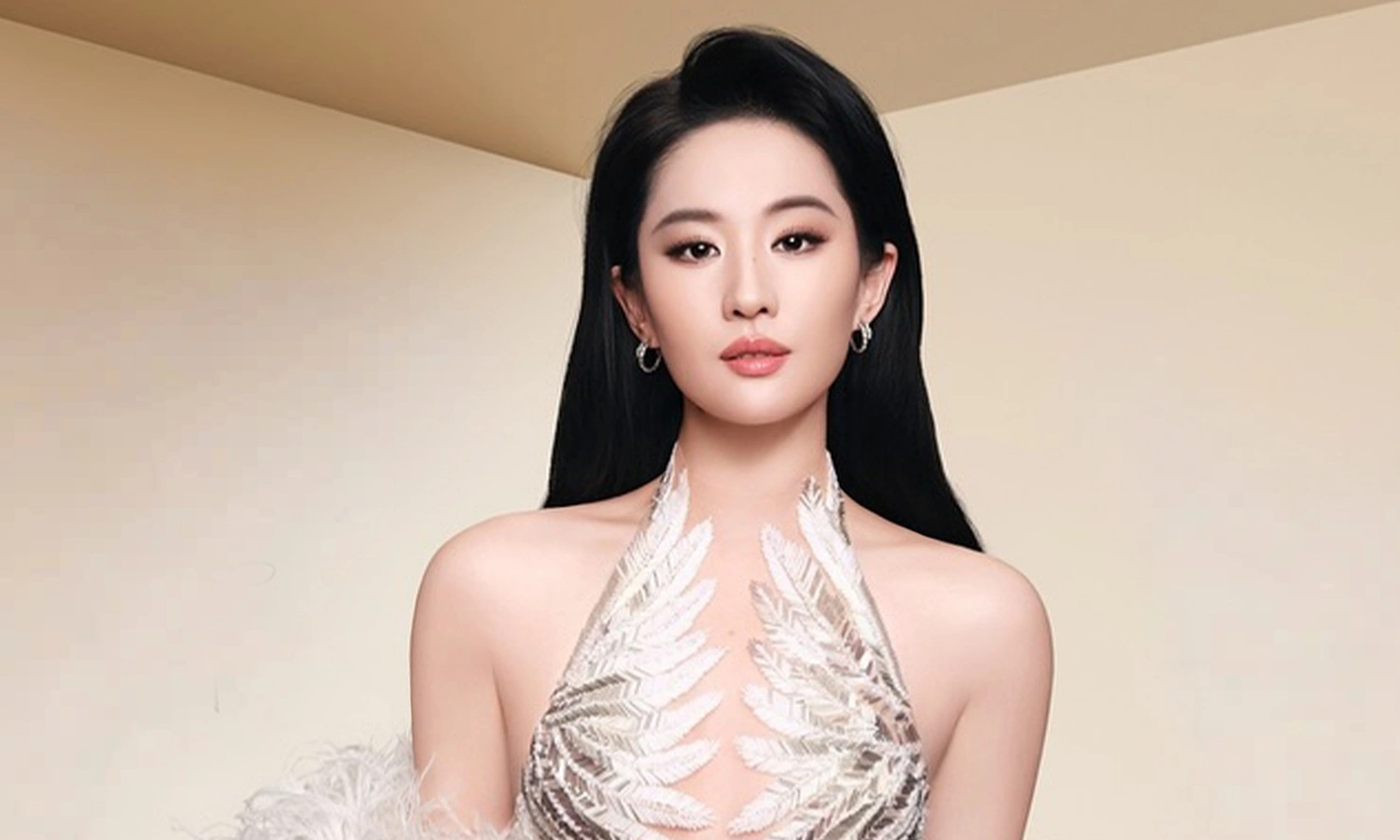 Liu Yifei dons cut-out gowns by Le Thanh Hoa
