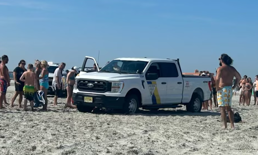 Police sued after driving over sunbather on beach