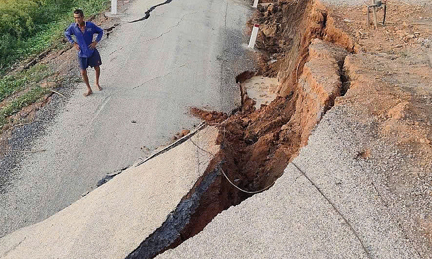 Newly paved riverside road collapses over 2 meters
