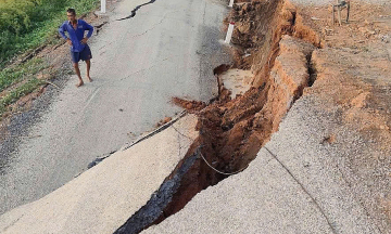 Newly paved riverside road collapses over 2 meters