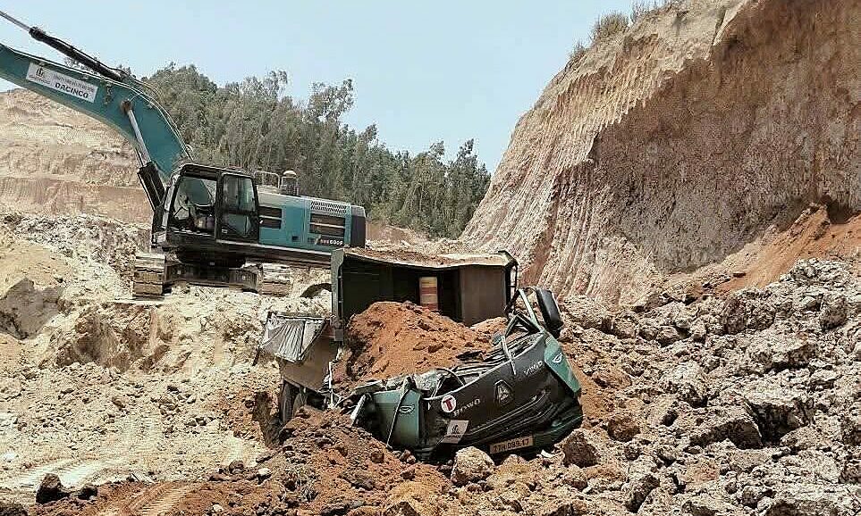 Landslide at soil mine buries truck cabin, driver dies