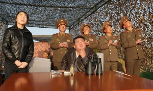 Kim and daughter oversee cluster warhead missile launch