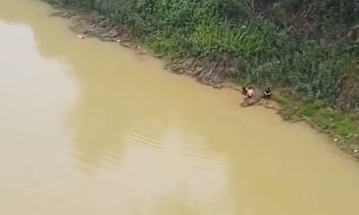 Two male students jump into river to rescue friend who leaped from bridge