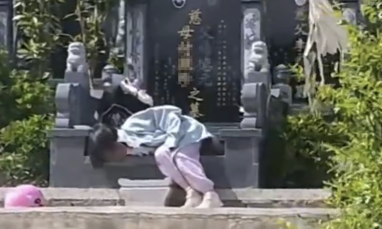 The story behind a young girl wanting to sleep by her grandparents' graves