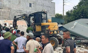 Two-story house collapses, one person trapped
