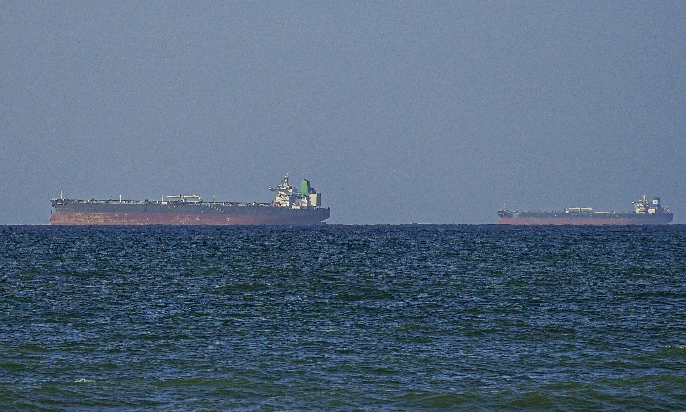 US warships support first two cargo ships through Hormuz