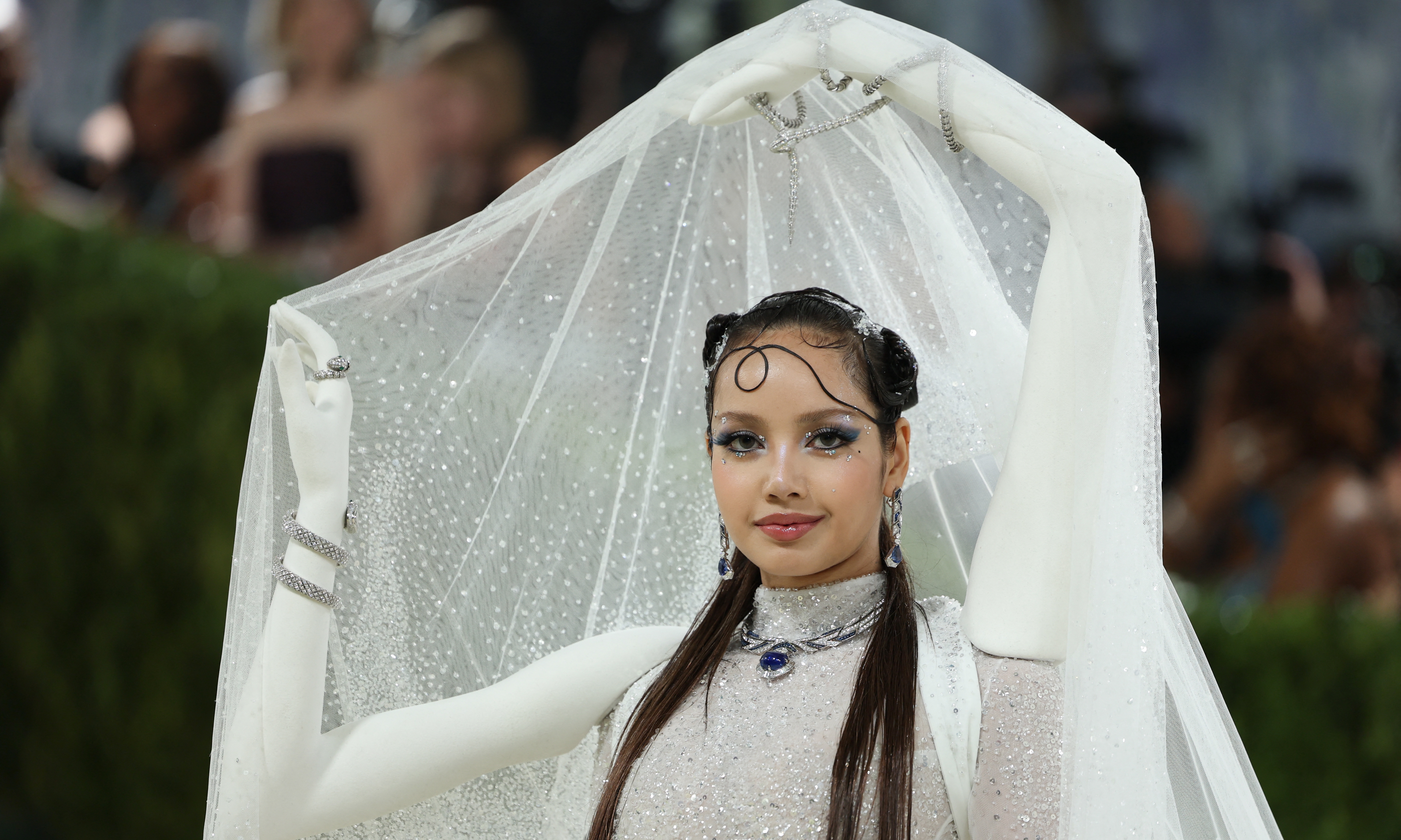 Lisa captivates with an arm-adorned gown at the Met Gala