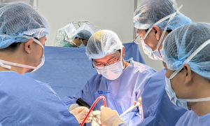 Why do artificial knee joints loosen after replacement?