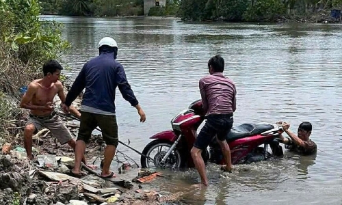 School employee's body and motorcycle found floating in river