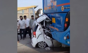 Police officer dies as car gets wedged under passenger bus