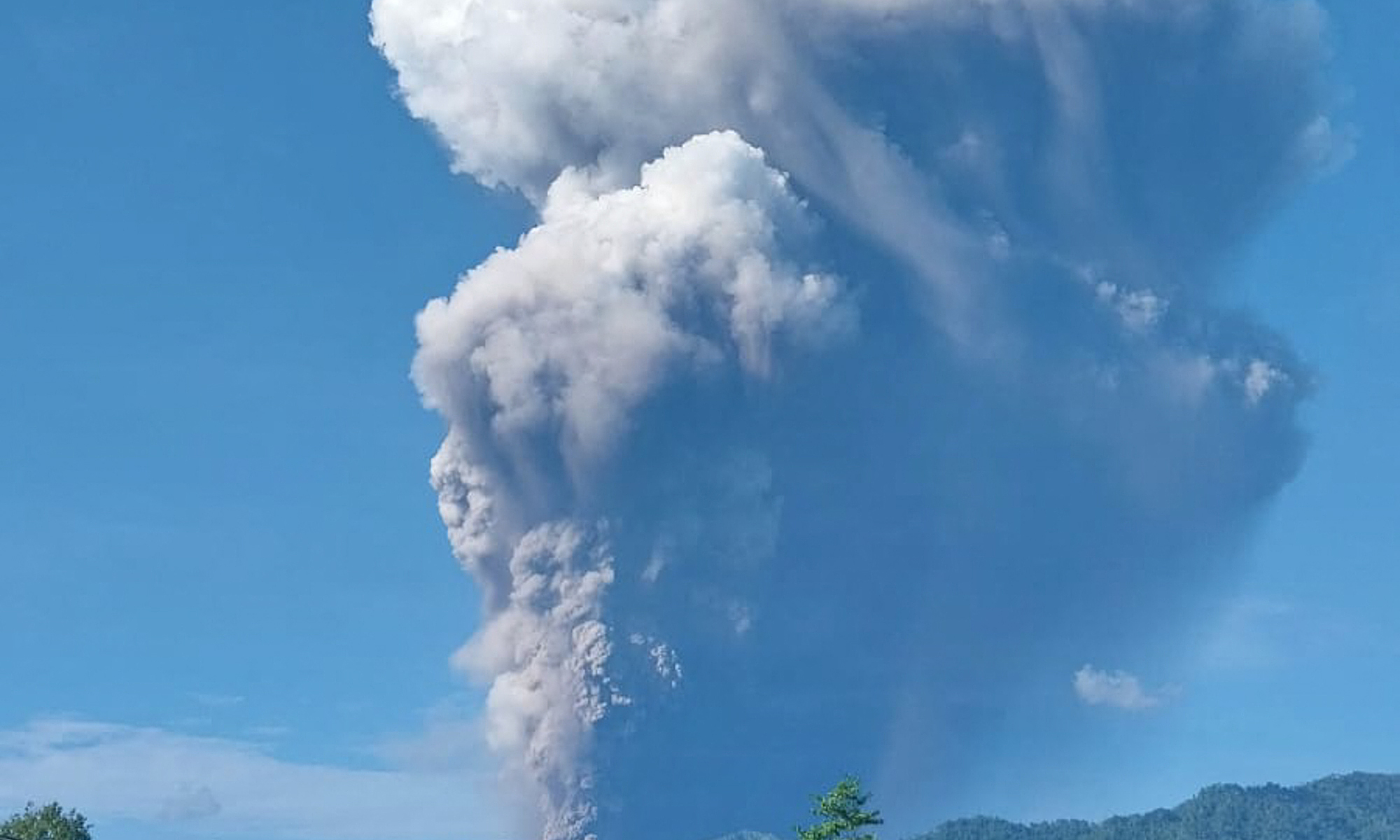 Moment volcano erupts before climbers' eyes