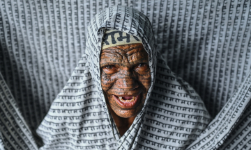Indian community tattoos divine names across their faces