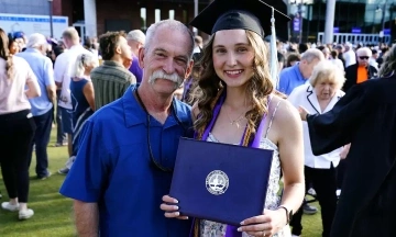 Firefighter attends graduation of girl he delivered