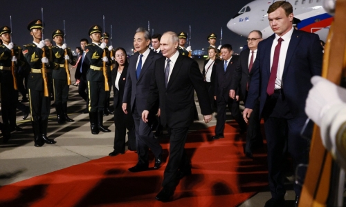 Video of Putin taking off his jacket in China goes viral