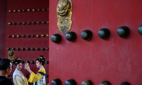 The meaning of the golden door studs on the Forbidden City gates