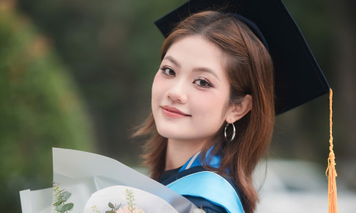 Female student graduates early with a perfect transcript