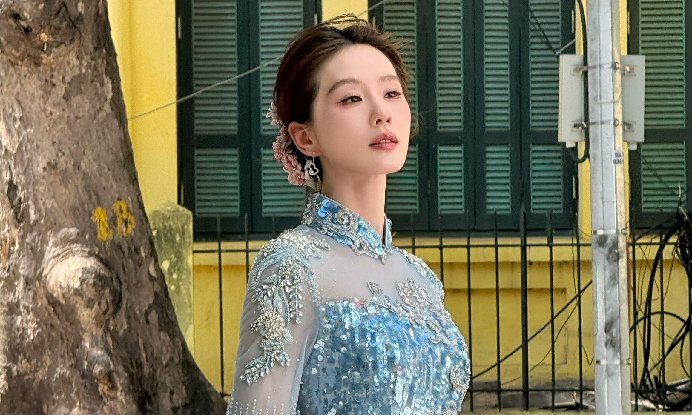 Liu Shi Shi poses on Hanoi streets