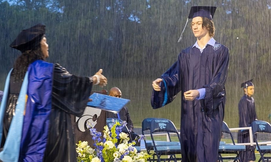 Graduation ceremony in torrential rain at a US high school
