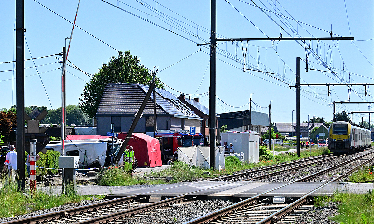 Train hits school bus in Belgium, 4 dead
