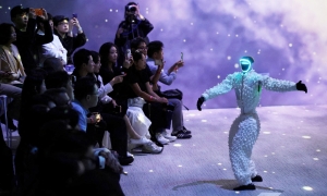 Robots compete on the catwalk with humans