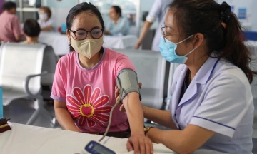 What does Ho Chi Minh City's free universal health check-up package include?