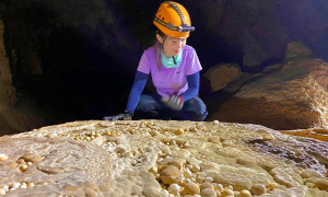 How is Hung cave, home to cave pearls, exploited for tourism?