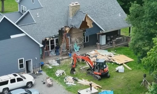 Enraged by wife's divorce filing, husband uses excavator to destroy house