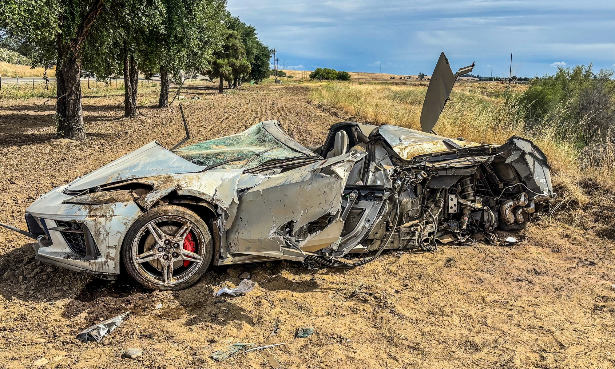 Sports car severely damaged in accident, driver survives