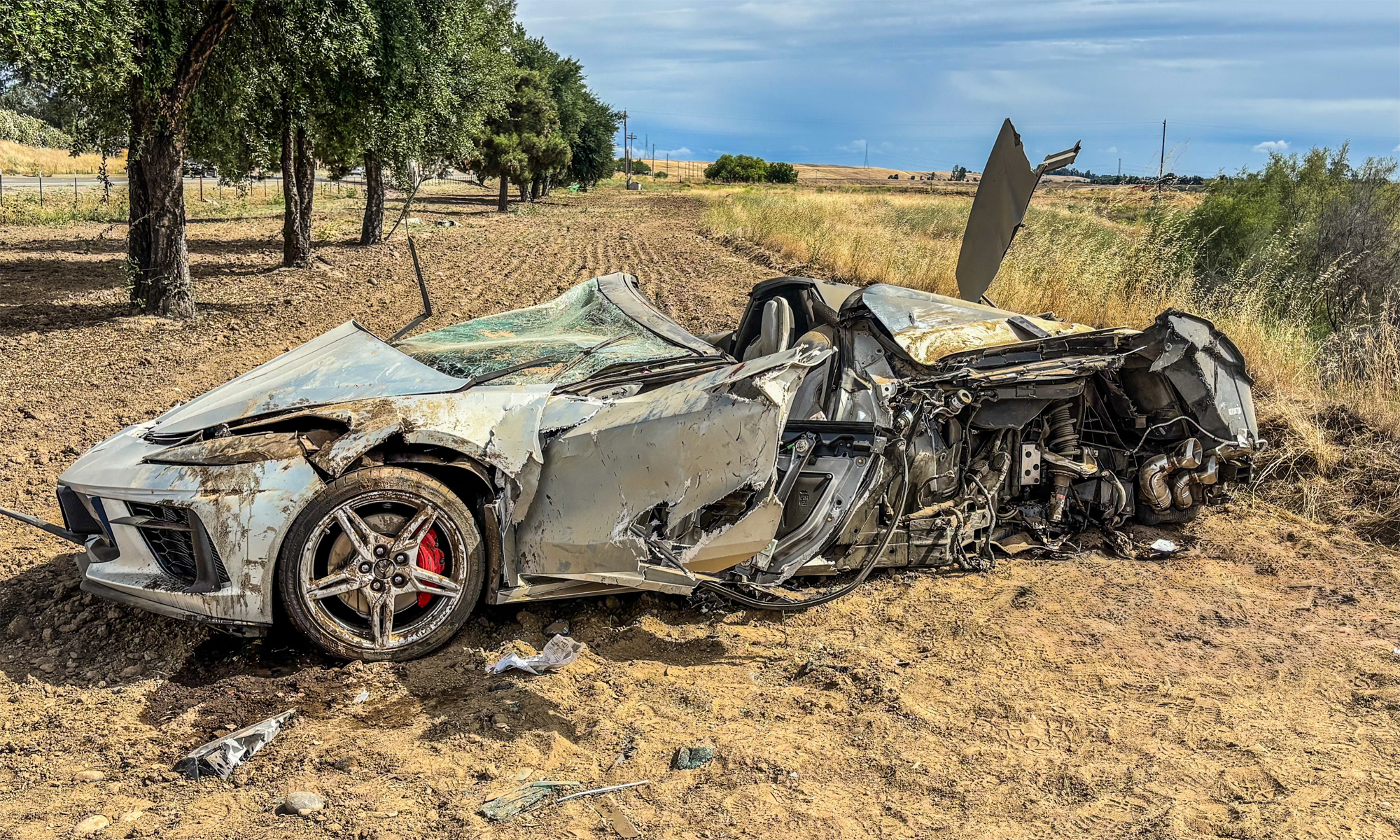 Sports car severely damaged in accident, driver survives