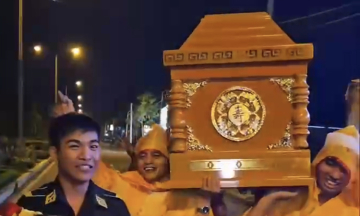 Carrying a coffin in a birthday street parade