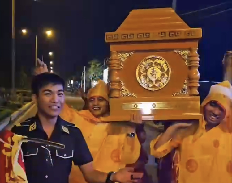 Carrying a coffin in a birthday street parade