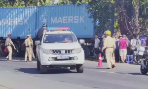 Agricultural tractor collides with container truck, three dead