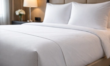 Why are hotel blankets often tucked tightly into mattresses?