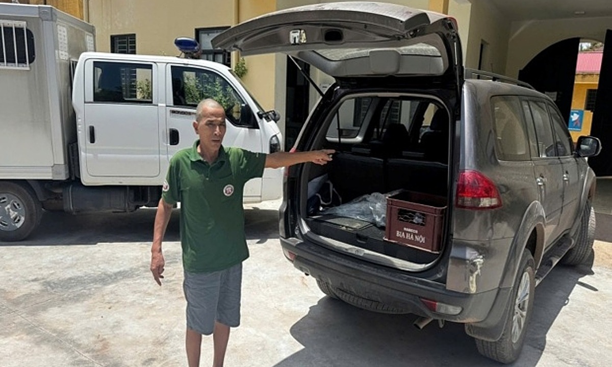 Two people arrested for placing cash envelope in police car