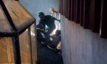 Police breach 'tiger cage' to rescue four people from fire