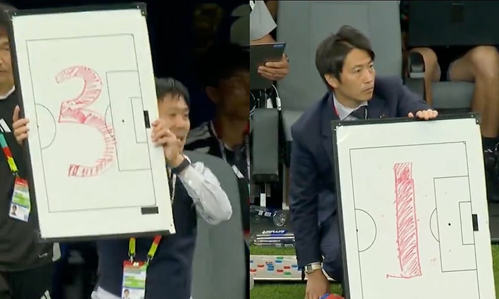 Why did the Japanese coach hold up a whiteboard with numbers?