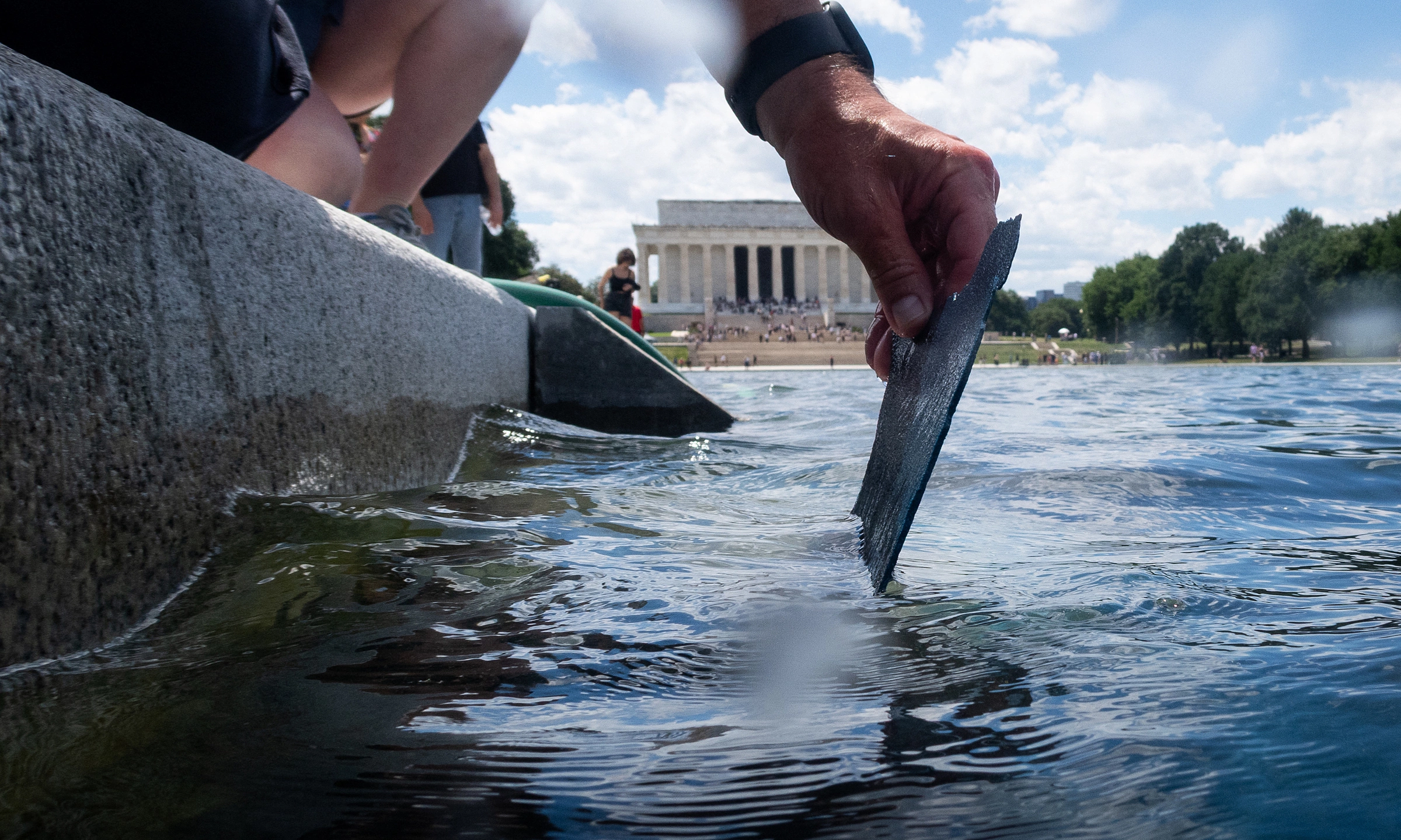 Reflecting pool bottom paint peeling after $14 million renovation