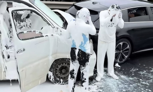 Paint covers occupants in white after vehicle rear-ends car ahead