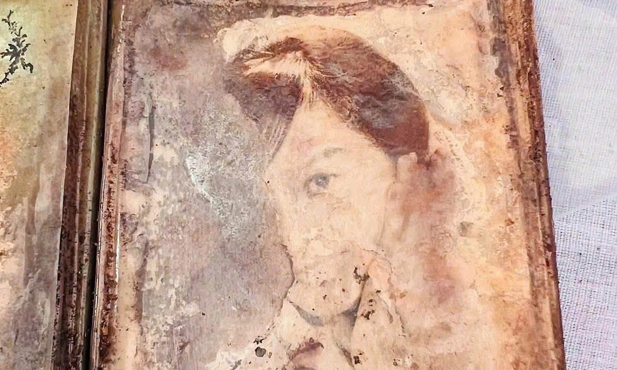 Photo album found in grave of unidentified martyr
