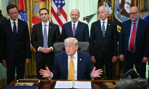 Executive order signing ceremony turns into a verbal clash in the Oval Office