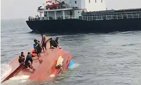 Fishing boat carrying 17 people sinks after cargo ship collision