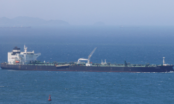 Oil tanker ablaze near Hormuz amid suspected Iranian missile strike