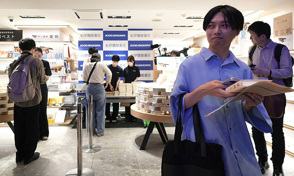 Readers queue at midnight for new Murakami book