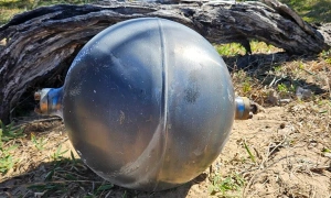 Australia beach closed due to 'mysterious black spheres'