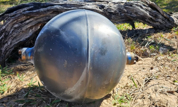 Australia beach closed due to 'mysterious black spheres'