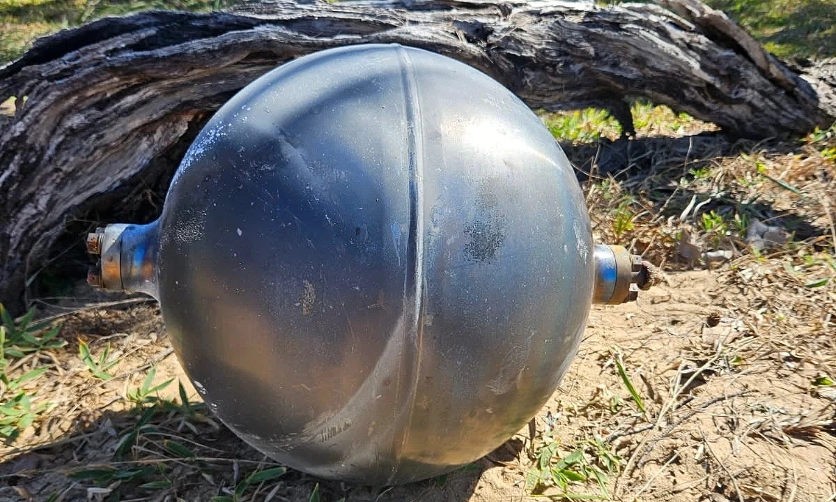 Australia beach closed due to 'mysterious black spheres'